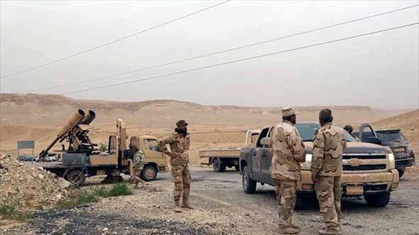 Den syriska armén står 15 kilometer från den strategiska flygbasen i Al-Raqa